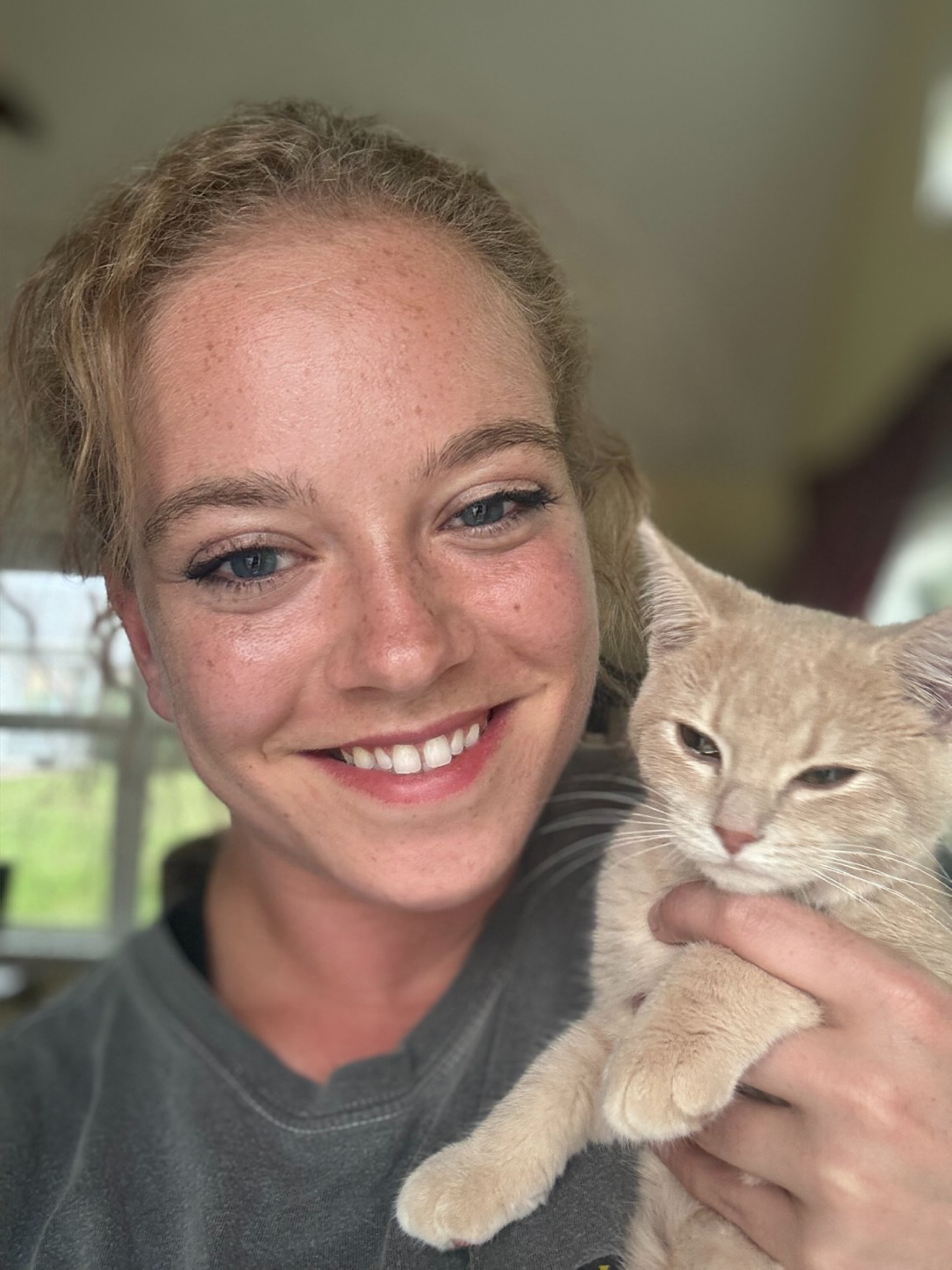 Taylor holding Sawyer, one of her cats